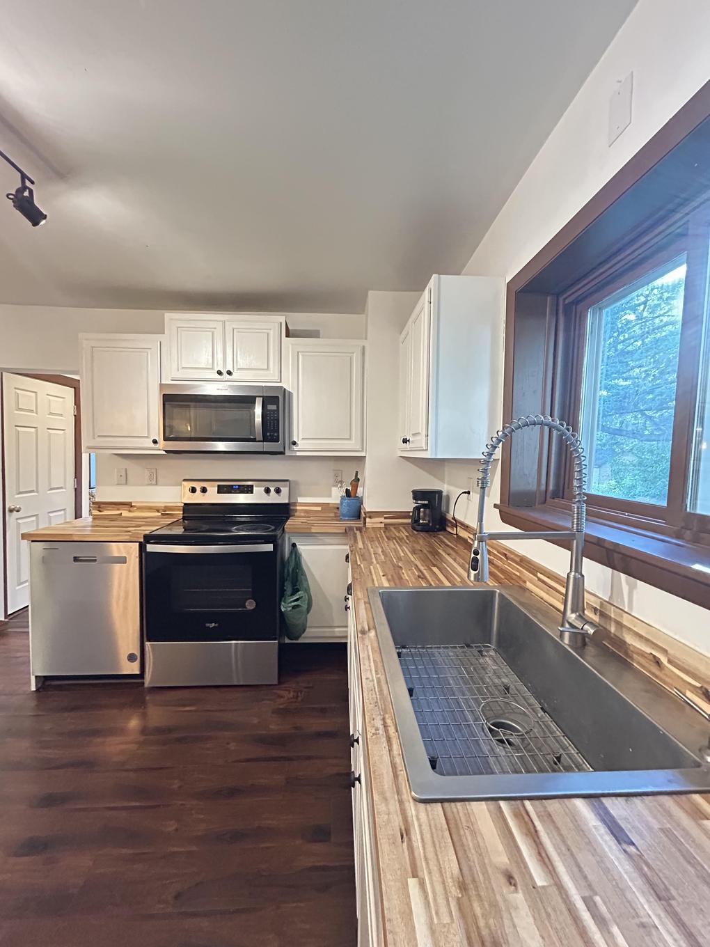 Kitchen range and sink with window over the counter