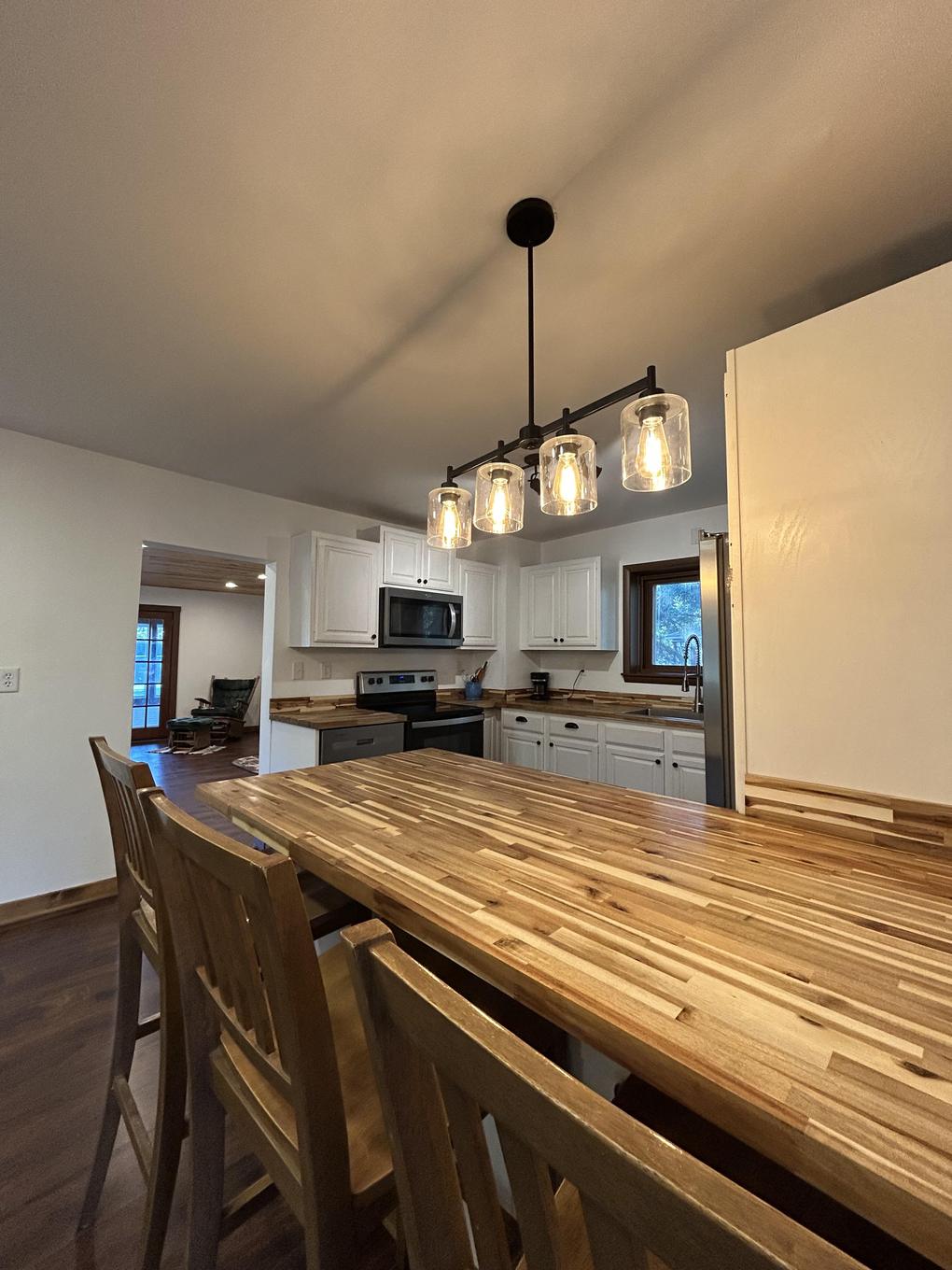 Kitchen and dining area with pendant lighting