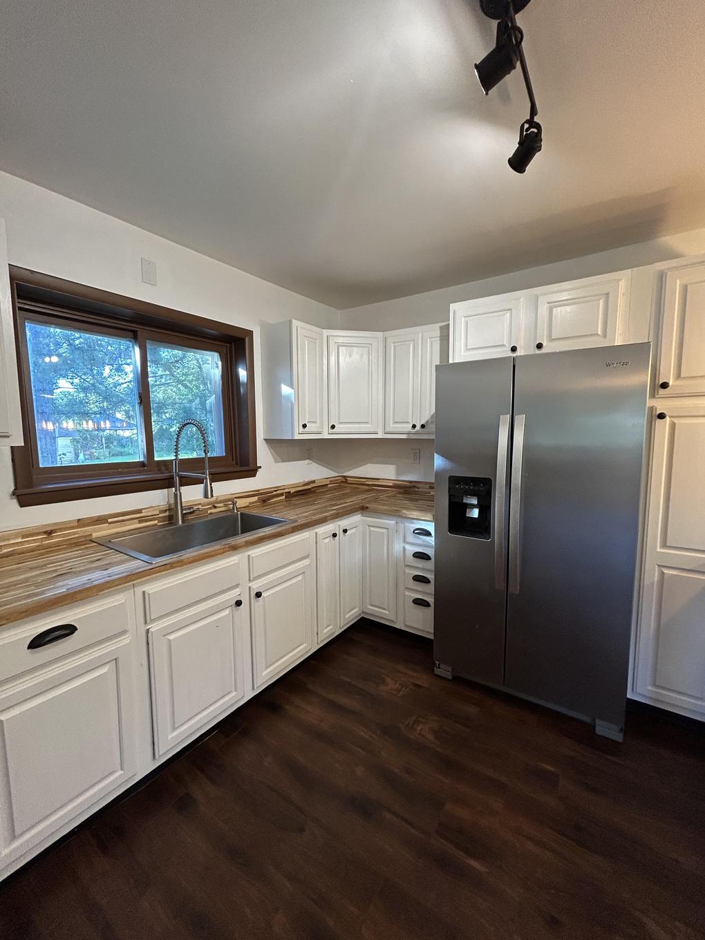 Kitchen cabinets and stainless refrigerator