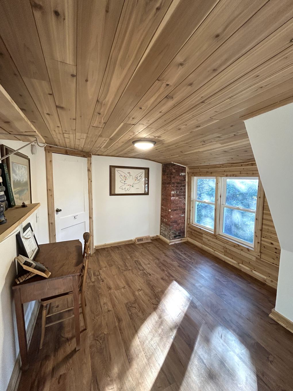 Home office nook detail with exposed brick chimney