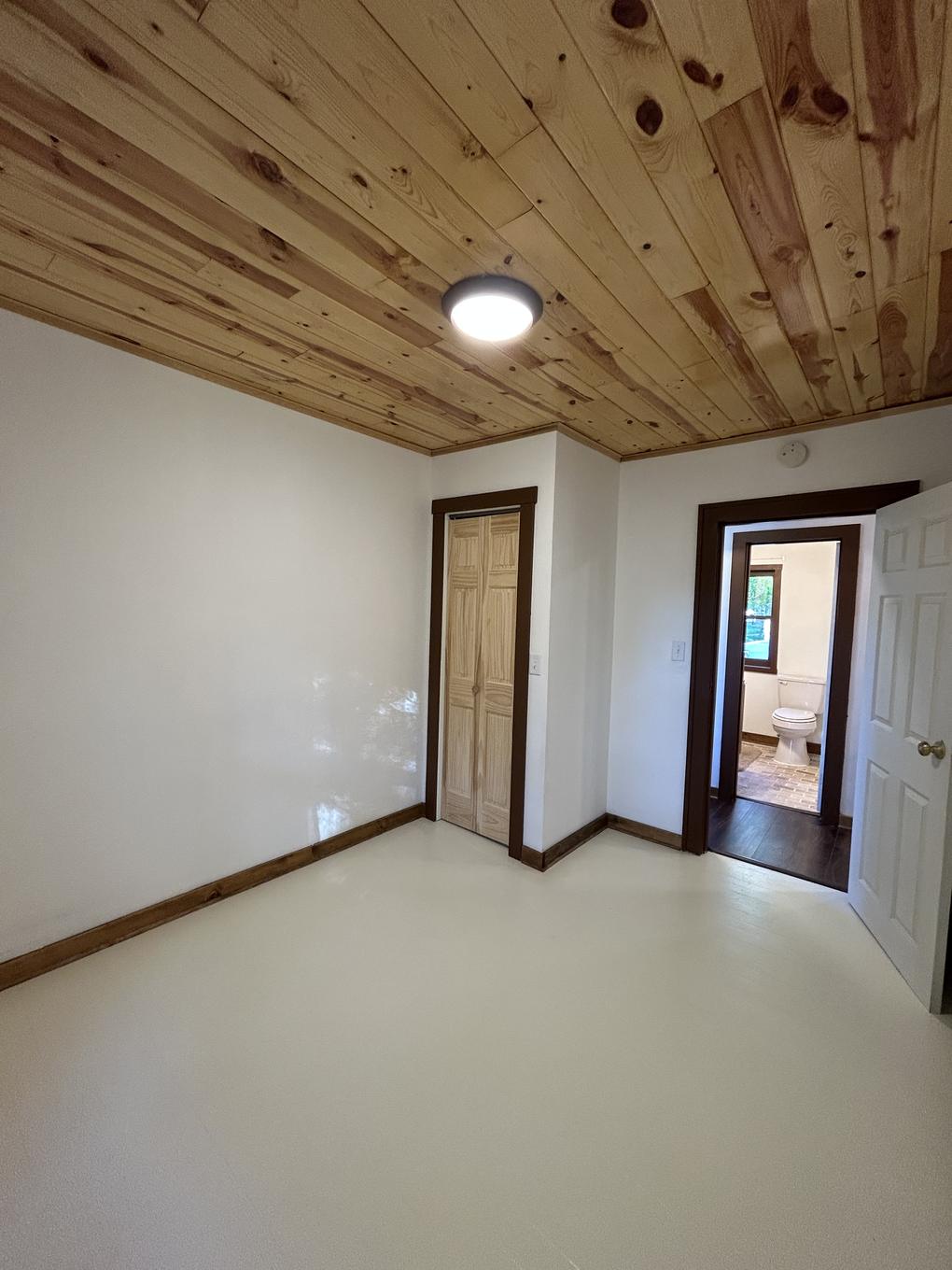Upstairs landing with a window and built-in bench