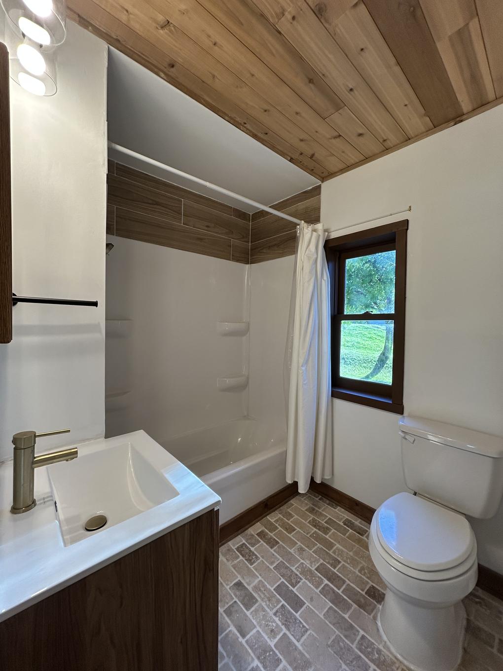 Primary bathroom tub and window detail